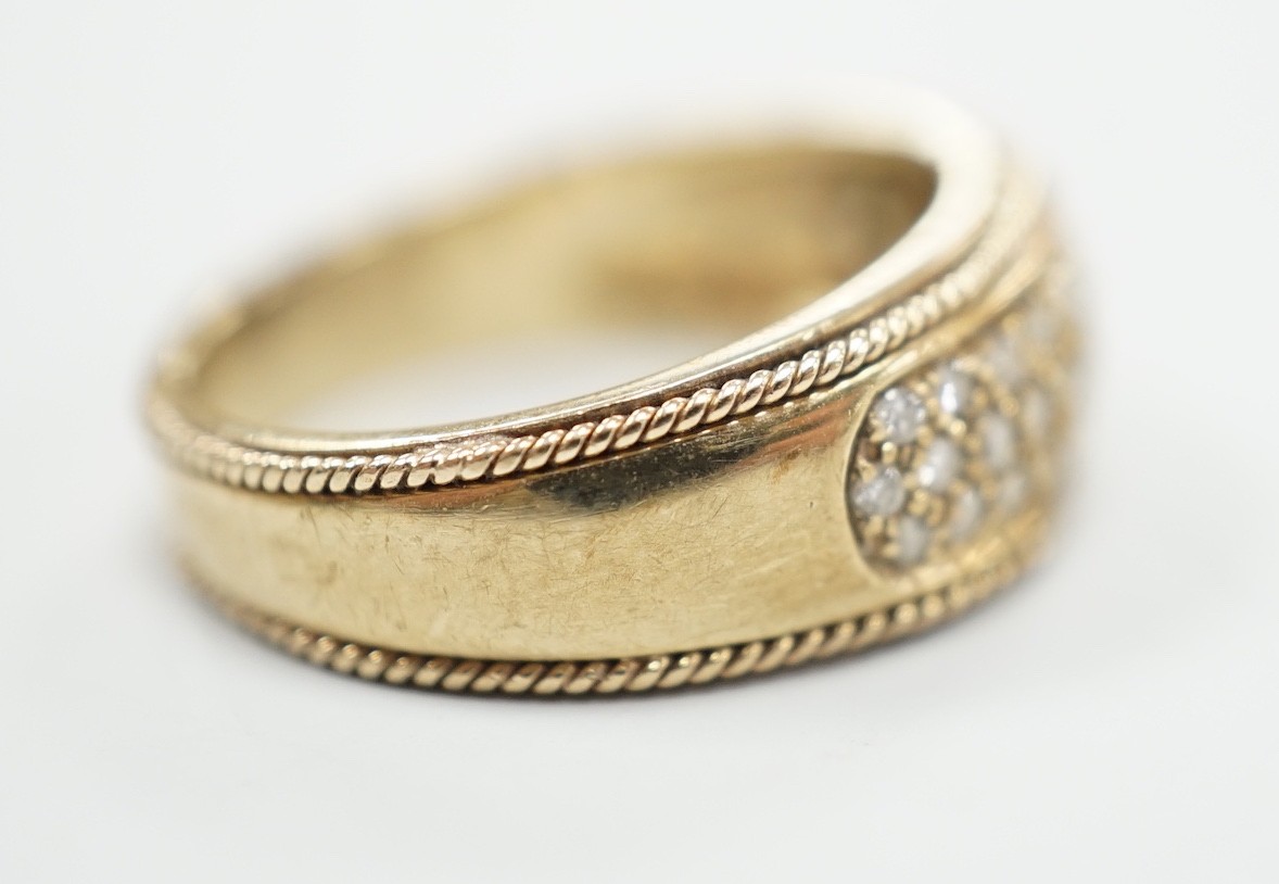 A modern 9ct gold and pave diamond chip set ring, size M/N, gross weight 4.5 grams.